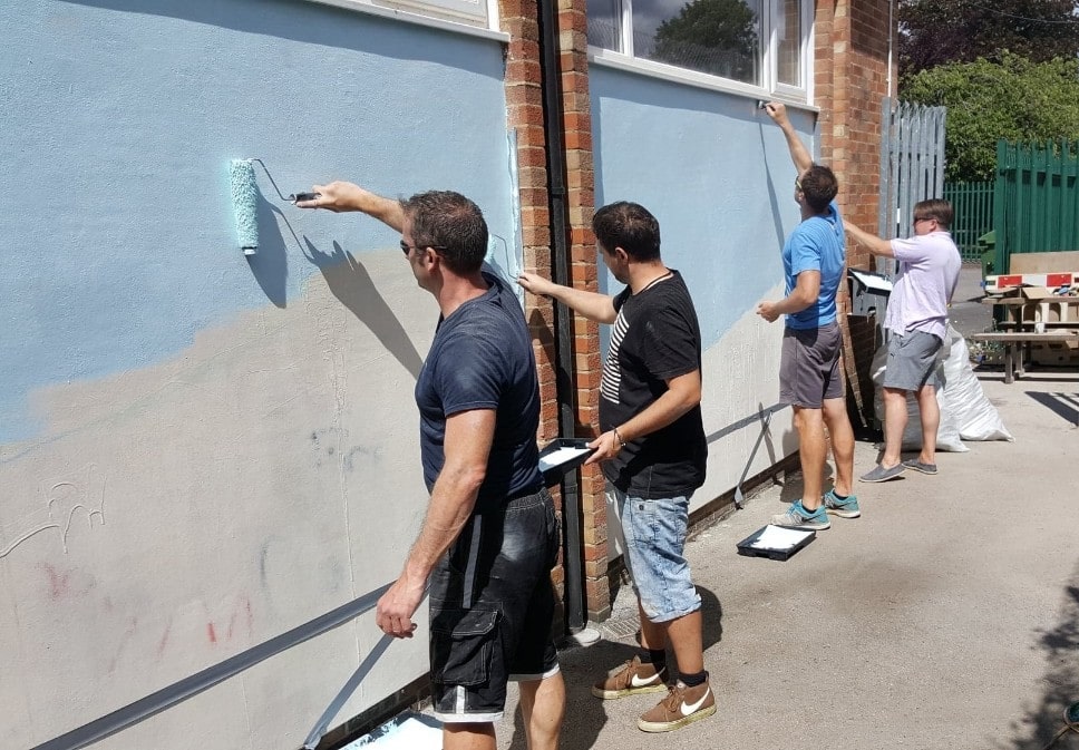 Protect Your Bubble team painting the walls at pinkneys green
