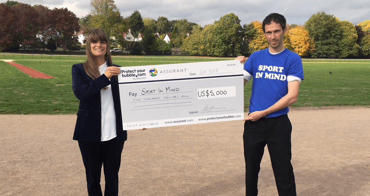 Protect Your Bubble present Neil Harris of Sport in Mind with a cheque from Assurant's global steps challenge