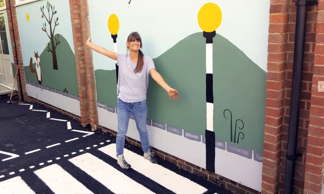 corinne finishes painting pinkneys green outdoor area with Protect Your Bubble